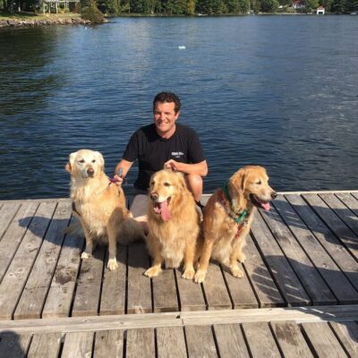 Rick Mercer with Goldens by the water
