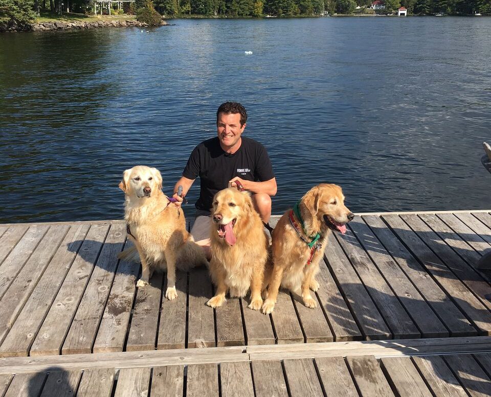 Rick Mercer with Goldens by the water